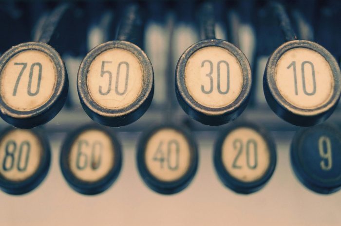 Close-up of a vintage typewriter showcasing numbered keys with a retro feel.